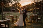 Budget-friendly backyard wedding reception with string lights and dancing couple