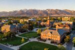 Scenic western US university campus with mountains in background
