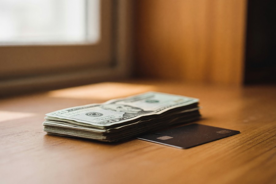 Side-by-side comparison chart of top cash back and travel credit card welcome bonus values in 2025